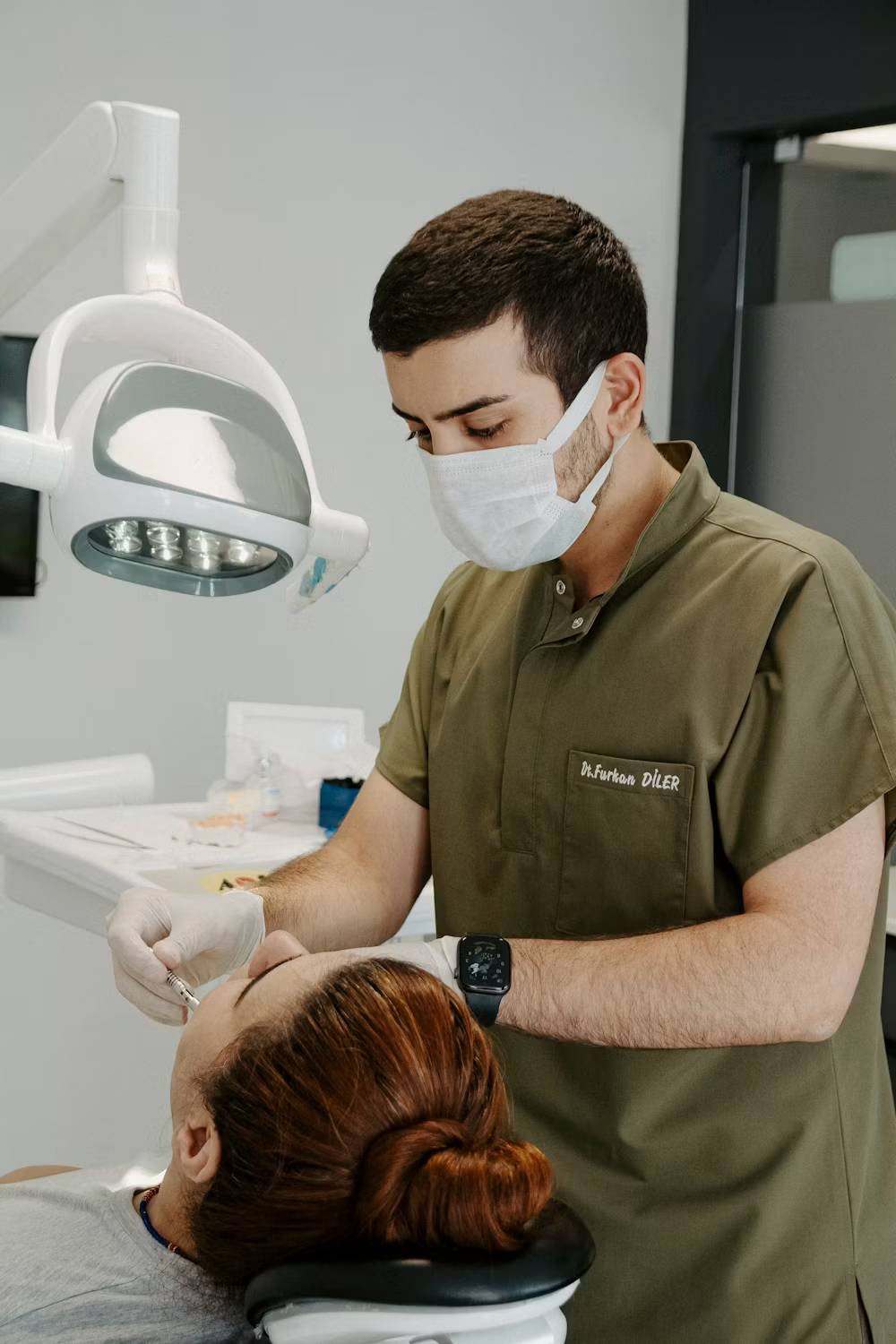 Dentist examining a patient's teeth in a modern clinic